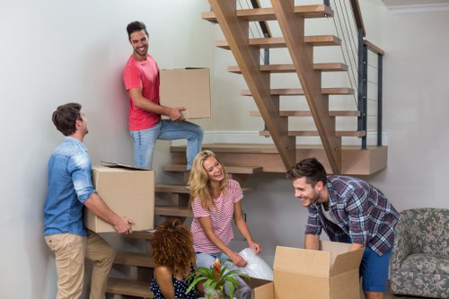 House removalists in Hornchurch loading moving boxes into a van