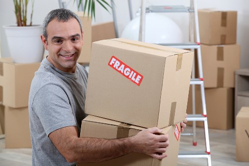 Removal van and moving crew handling household items