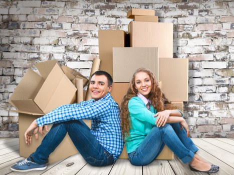 Packing boxes and wrapping fragile household items for a move in Hornchurch