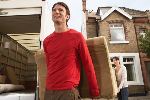 Professional movers handling office furniture during a Hornchurch business relocation