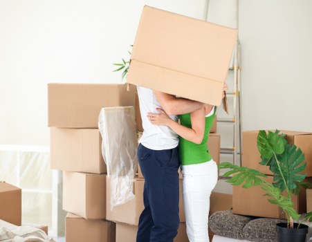 Specialist movers transporting an upright piano in Hornchurch