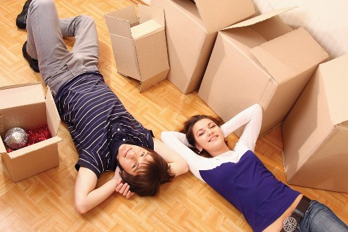 Professional moving help loading boxes into a van