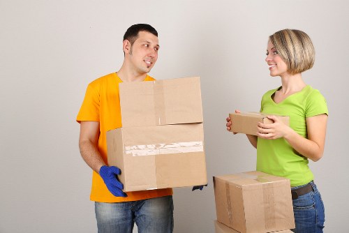 Protective wrapping and careful loading for a piano move in Hornchurch