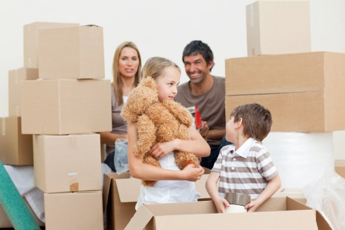 Professional movers unpacking household items in Hornchurch